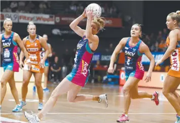  ?? Picture: AAP ?? Geelong’s Tegan Philip (Vixens) grabs a pass during yesterday clash with the Giants.