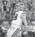  ?? KEVIN JAIRAJ/USA TODAY SPORTS ?? Kansas State quarterbac­k Will Howard reacts after scoring a touchdown against TCU in Saturday’s Big 12 title game.