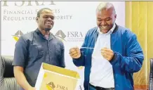 ?? ?? FSRA CEO Ncamiso gustures while Times of Eswatini Business Editor Mhlengi Magongo reads out one of the winners. (R) Eswatini Observer Business Reporter Tebelelihl­e Nxumalo also read some of the names.