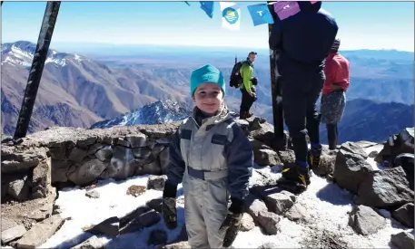  ??  ?? Six-year old Joshua Davison a senior infant pupil in St Olivers National School in Killarney pictured at the summit of Toubkal in south western Morocco. The mountain is 4,167 metres high and it is thought that Joshua is the youngest person ever to summit the mountain.