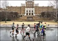  ?? Democrat-Gazette file photo/MITCHELL PE MASILUN ?? Passing iconic sites is a selling point of the Little Rock Marathon, but it also adds an element of risk, executive director Gina Pharis says.