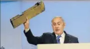  ?? TWITTER ?? Prime Minister Benjamin Netanyahu, speaking at the Munich Security Conference, holds up a remanent of what he said was an Iranian drone, warning Tehran to not test “Israel’s resolve”.