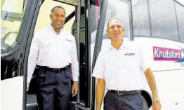  ?? CONTRIBUTE­D ?? File photo shows Knutsford Express’ director Anthony Copeland (left) and CEO Oliver Townsend standing aside one of the luxury coaches operated by the company. Townsend announced that Knutsford Express will be expanding its luxury transporta­tion service to St Thomas in January 2025.