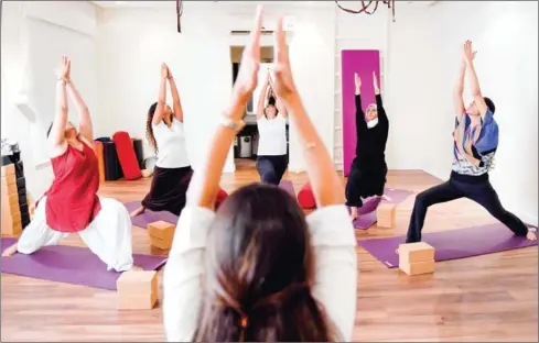  ?? AMER HILABI/AFP ?? Nouf Marwaai, head of the Arab Yoga Foundation, instructs her yoga students at her studio in Jeddah, Saudi Arabia, on September 7.
