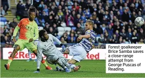  ?? ?? Forest goalkeeper Brice Samba saves a close-range attempt from George Puscas of Reading.