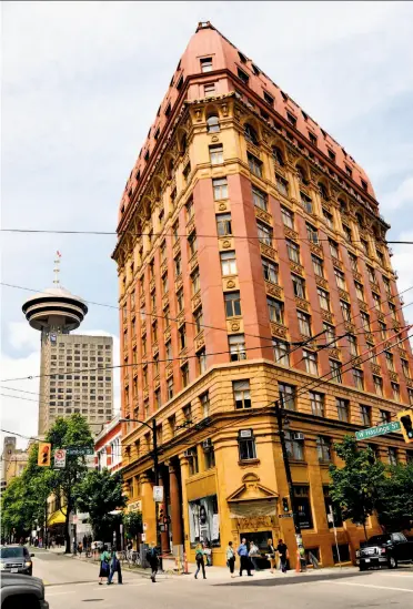  ?? Photos by Margo Pfeiff / Special to The Chronicle ?? In Gastown, preserved heritage buildings sit alongside prime downtown real estate, such as the historic 1910 Dominion building shown here, with Vancouver’s Harbour Centre tower in the background.