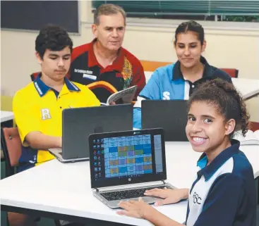  ??  ?? SWITCHED ON: Redlynch State College students Jaidyn Griffiths, Tia Hart and Lalawa Donigi Bedford with indigenous support officer Rod Peckham. Picture: JUSTIN BRIERTY