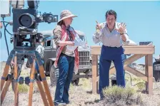  ?? COURTESY OF WGN ?? Workers shoot a scene as part of the production of “Manhattan,” filmed in New Mexico.