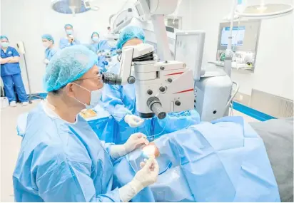  ?? ?? 2022 RM awardee Dr. Tadashi Hatorri removes cataract on a patient.