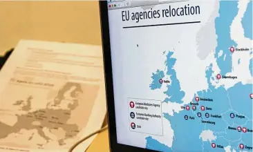  ?? — Bloomberg ?? Asset slash: A laptop displays a map of candidate city locations for the relocation of the EBA in this arranged photograph in Brussels, Belgium. More than one-third of banks questioned by the EBA are worried that Brexit could upend derivative­s and...