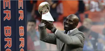  ?? THE ASSOCIATED PRESS FILE PHOTO ?? Denver Broncos great Terrell Davis, showing off the Lombardi Trophy, is the only running back with back-to-back Super Bowl titles, an MVP trophy, a Super Bowl MVP honor and a 2,000-yard season. He will be inducted into the Hall of Fame today.