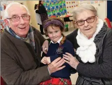  ??  ?? Ella Kelly with her grandparen­ts Seán and Anne O’Reilly.