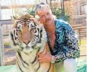  ?? NETFLIX US/AFP VIA GETTY IMAGES ?? Netflix TV show “Tiger King” main character Joe Exotic poses with a tiger.