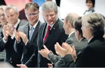  ?? PAUL CHIASSON/THE CANADIAN PRESS ?? Prime Minister Stephen Harper is applauded as he is introduced at a Montreal Board of Trade luncheon on Friday.