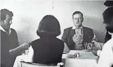  ?? JOHN R. HAMILTON, JOHN WAYNE ENTERPRISE­S ?? Wayne, his wife, Pilar, and Dean Martin play cards during The Sons of Katie Elder filming. Cards were a staple, his son says.