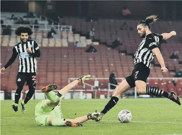  ??  ?? Arsenal keeper Bernd Leno denies Andy Carroll late in normal time at the Emirates Stadium.