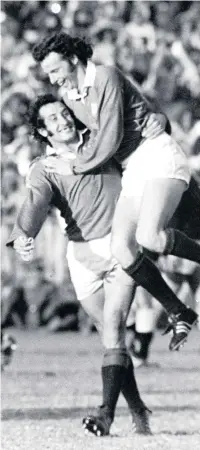  ??  ?? JJ Williams celebrates with Gareth Edwards after scoring the first of his two tries in the third Test for the Lions against South Africa in 1974