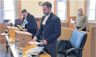  ?? TARA BRADBURY • THE TELEGRAM ?? Former Anglican priest Robin Barrett stands in the dock in Courtroom 2 at Newfoundla­nd and Labrador Supreme Court in St. John’s Monday, behind his lawyer, Mark Gruchy (left) and prosecutor Shawn Patten.