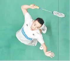  ??  ?? Datuk Lee Chong Wei plays a return to South Korea Lee Hyun Il during their Malaysia Open men’s singles match at the Axiata Arena in Kuala Lumpur. Chong Wei won 21-7, 21-7 to secure his spot in the quarter-finals. — Bernama photo