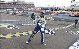  ?? RALPH FRESO - THE ASSOCIATED PRESS ?? Chase Elliott celebrates at the finish line after winning the season championsh­ip and a NASCAR Cup Series race at Phoenix Raceway on Nov. 8 in Avondale, Ariz.
