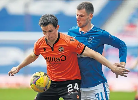  ??  ?? HOLDING ROLE: Lawrence Shankland shielding the ball from Rangers defender Borna Barisic at Ibrox in February.