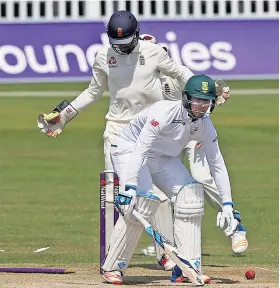  ??  ?? Gone: South Africa A’s Beuran Hendricks is out bowled as Ben Foakes looks on