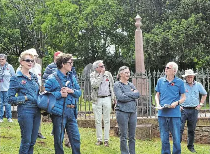  ?? Picture: MARK CARRELS ?? ENGAGING TALK: Tom Penlington discusses Settler history with a group attending a Bathurst historical trail walk on Saturday November 4, while visiting the Methodist Church Cemetery where some of the church founders are buried.