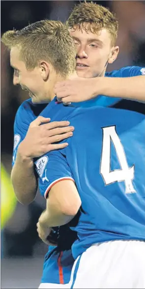  ??  ?? n Robbie Crawford celebrates his goal on Friday night with Lewis MacLeod.