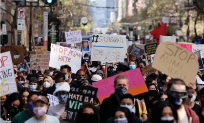  ?? Photograph: John G Mabanglo/EPA ?? Asian Americans and Pacific Islander (AAPI), and supporters march on Market Street to condemn hate and violence against the Asian community in San Francisco, California, on 26 March 2021.