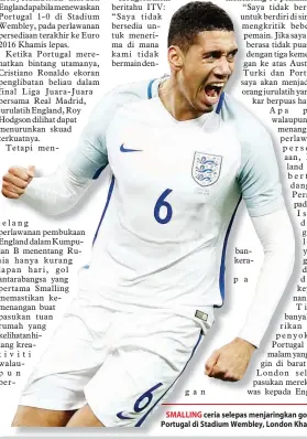  ?? — Gambar AFP ?? SMALLING ceria selepas menjaringk­an gol kemenangan England pada perlawanan persahabat­an menentang Portugal di Stadium Wembley, London Khamis lepas.