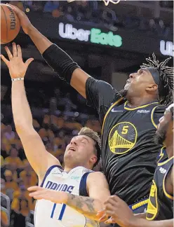  ?? JED JACOBSOHN/ASSOCIATED PRESS ?? Golden State Warriors center Kevon Looney (5) blocks a shot attempt by Dallas Mavericks guard Luka Doncic during Game 1 of the Western Conference Finals on Wednesday night in San Francisco. Doncic was held to 20 points.