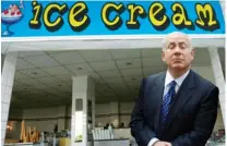  ?? (Shooters) ?? PRIME MINISTER Binyamin Netanyahu reacts to the news of Obama’s new position, before drowning his sorrows at the capital’s ‘Metudela’ ice cream shop.