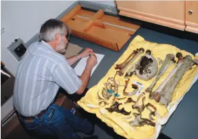  ?? UNBC HANDOUT PHOTO ?? UNBC forensic anthropolo­gist Richard Lazenby at work.