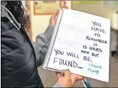  ??  ?? Student Annika laband holds her notebook, in which she writes about her feelings about sobriety.