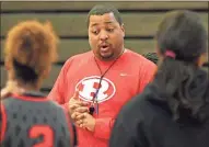  ?? / Jonathan Blaylock ?? Rome High girls’ basketball coach Jason Harris talks to his team during practice Wednesday. The Lady Wolves go on the road Friday to play Jackson- Atlanta in the first round of the Class 5A state playoffs.