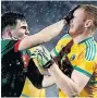  ??  ?? SHOVE AFFAIR Ross Egan with Leitrim’s Colm Moreton