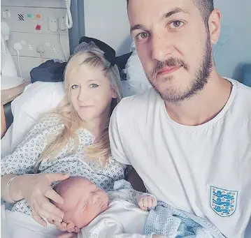  ?? FAMILY OF CHARLIE GARD VIA THE ASSOCIATED PRESS ?? Connie Yates and Chris Gard with their son Charlie Gard in an undated photo provided by the family. Despite the parents’ opposition, a European court has ruled the terminally ill infant should be taken off life support.