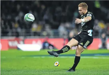  ?? PHOTO: GETTY IMAGES ?? Extras added . . . Ihaia West, of the Hurricanes, kicks a conversion during last night’s Super Rugby match between the Hurricanes and the Sharks at McLean Park, in Napier.