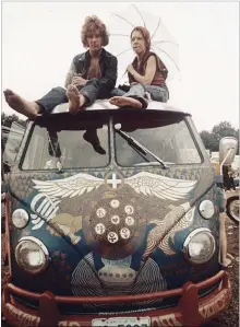  ?? ANONYMOUS THE ASSOCIATED PRESS ?? Concert-goers sit on the roof of a Volkswagen bus at the Woodstock Music and Arts Fair at Bethel, N.Y. in 1969, when “the world was a very different place.”