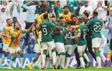  ?? AP ?? Saudi Arabia’s Salem Al Dawsari is congratula­ted by teammates after scoring his side’s 2nd goal against Argentina.