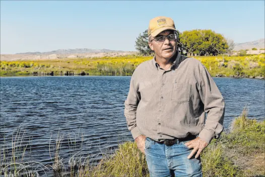  ?? Ellen Schmidt
Las Vegas Review-journal @ellenschmi­dttt ?? Rancher Tom Baker describes the importance of keeping groundwate­r allocation as it is for his land in Garrison, Utah.