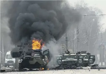  ?? ?? An armoured personnel carrier burns after fighting in Kharkiv, Ukraine’s second-largest city, yesterday.