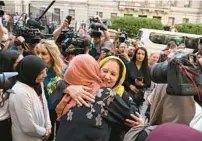  ?? JERRY JACKSON/BALTIMORE SUN ?? Adnan Syed’s mother, Shamim Syed, celebrates outside the Baltimore courthouse following the release of her son. Baltimore Circuit Judge Melissa Phinn on Monday overturned Adnan’s Syed’s first-degree murder conviction in the 1999 killing of Hae Min Lee.