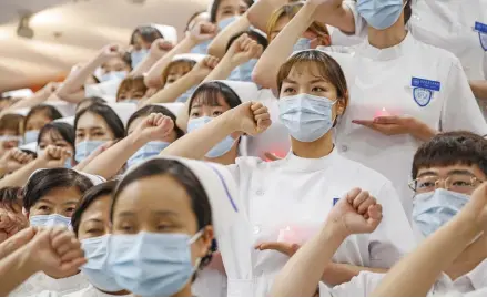  ?? Photo: Xinhua ?? Newly-recruited nurses take an oath during a capping ceremony at Peking University People’s Hospital in Beijing, capital of China, on April 26, 2020.