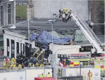  ??  ?? 0 Ten people died when the helicopter hit the Clutha Vaults pub in 2013