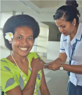  ?? Photo: Waisea Nasokia ?? Turtle Island Resort staff Mere Makitalini gets her first COVID-19 vaccine jab at the Nadi Internatio­nal Airport on April 8, 2021.