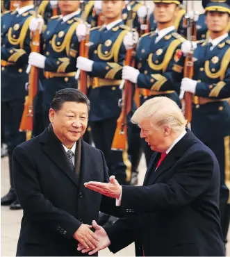  ?? THE ASSOCIATED PRESS ?? U.S. President Donald Trump and Chinese President Xi Jinping participat­e in a ceremony n Beijing. “The Chinese have an alternativ­e model for their investment­s and they’re increasing­ly going to be seen as the most important driver of other economies...