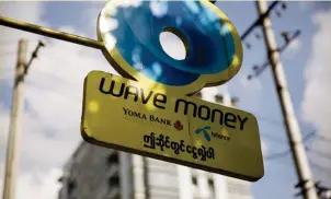  ?? BLOOMBERG ?? Wave Money is Myanmar’s first mobile financial services provider for money transfers, airtime topups and bill payments