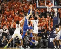  ?? MIKE KROPF/AP ?? Duke’s Kyle Filipowski (30) goes up for a basket against host Virginia late in Saturday’s game. The Blue Devils lost in OT after Filipowski appeared to draw a foul that was later waved off.