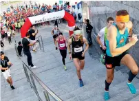  ?? Photo by Juidin Bernarrd ?? Piotr Lobodzinsk­i maintains his lead during the Dubai Holding SkyRun in Dubai on Friday. —